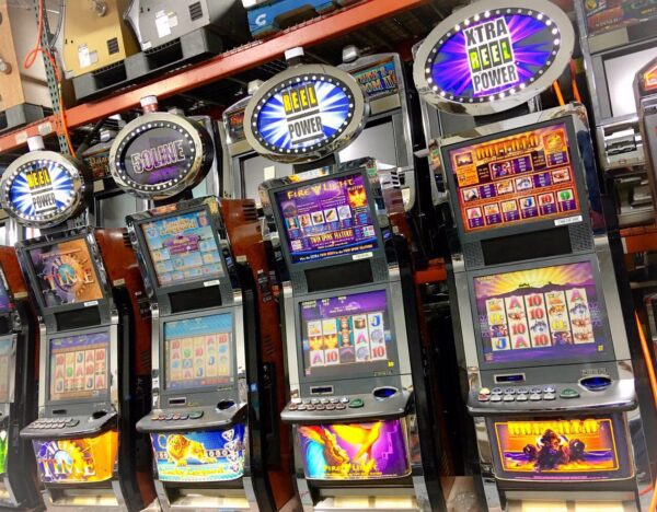 A row of slot machines in a store.