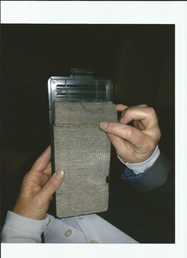 A person holding a 3M HAF Air Filter System. GETT Part 13-1970 in their hand.