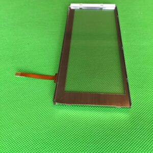 A small 4 WIRE TOUCHSCREEN for 6.2"LCD on a green surface.