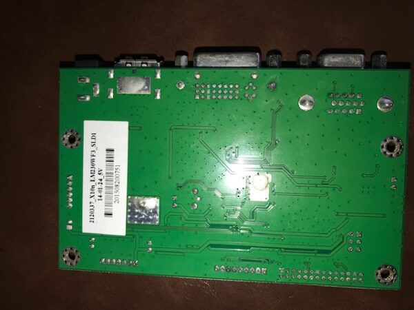 A green AD Board 2120337, Fits 23"Tatung Monitors for use with Bally Games, Others circuit board on a table.