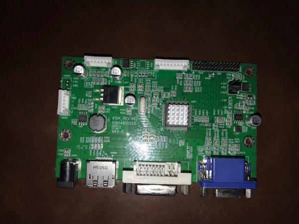A green AD Board 2120337, Fits 23"Tatung Monitors for use with Bally Games, Others on a table.