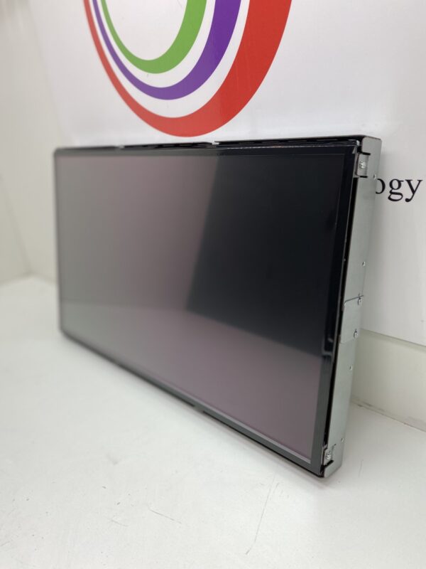 A 22" LCD Touch Monitor for use with Bally Games. PN# 7000386 and GETT Part LCDM1012 is sitting on a table in front of a wall.