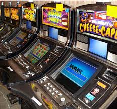 A row of 7" LCD for WMS BB1 Upright games GETT Part #LCDM1014 slot machines in a casino.