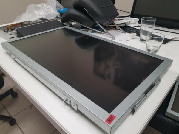 A 32" Tovis LCD Monitor sitting on top of a desk.