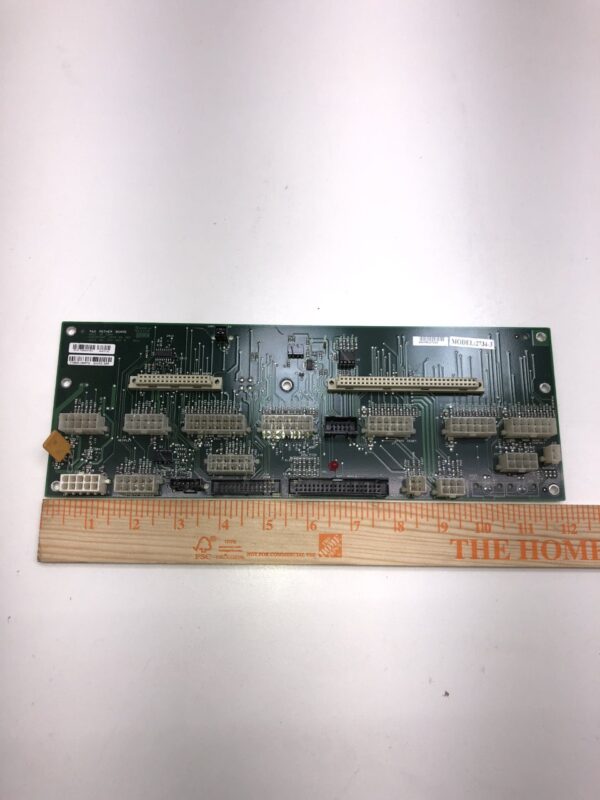 A small IGT 960 Enhanced BackPlane Board with a ruler on it. Model 2734-3. GETT Part BPLN113.