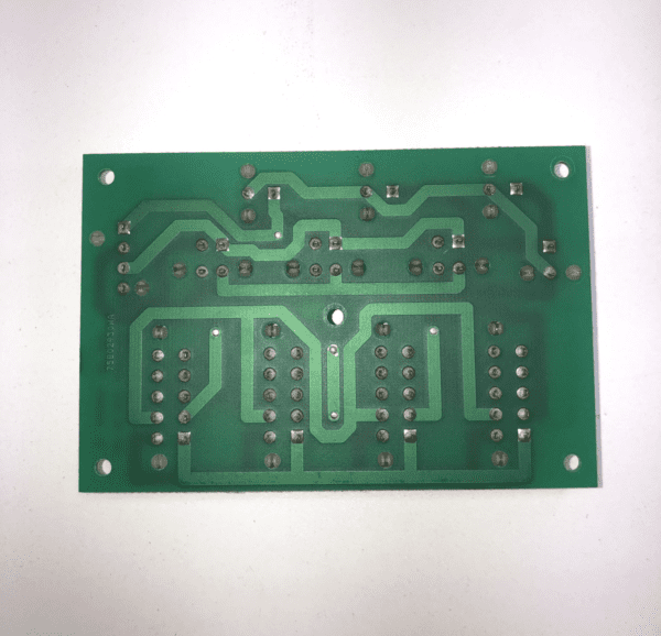A green IGT AVP Netplex Power Distribution Board on a white surface.