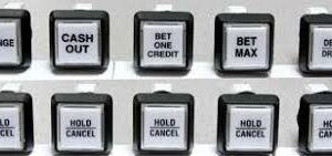 A group of IGT Bartop Button Assy. "HOLD / CANCEL" Sq. VLT. GETT Part BTN128 buttons with different words on them.