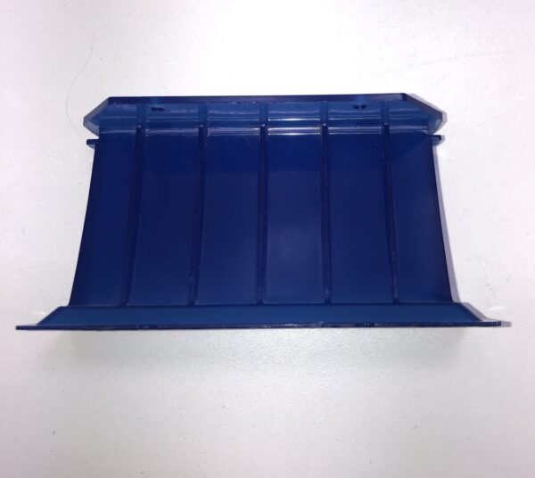 A blue plastic tray on a white surface.