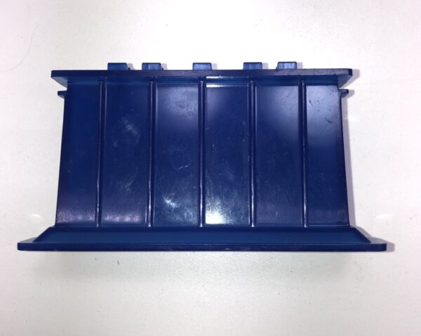 A blue plastic Bezel for UBA (JCM) Bill Validator on a white surface.