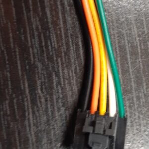 A red, yellow, green, and blue 5-Pin Extension cable. 5Pin-5Pin, 5" wire on a table.
