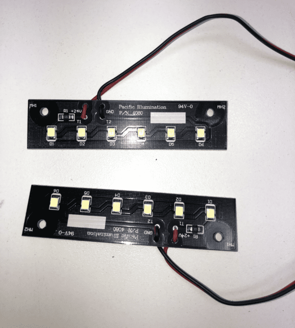A pair of 24v Dual LED Boards for Bally 6000+9000 Validator with wires attached to them.