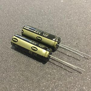 Two 2.5v 10f Panasonic supercapacitors on a surface.