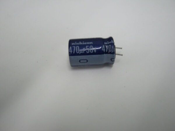A 470uf 50v Nichincon Aluminum Electrolytic Capacitor - Leaded on a white surface.