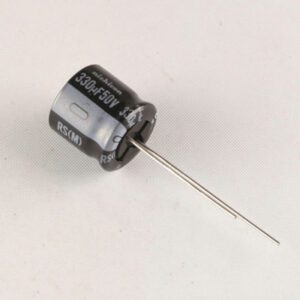 A 330uf 50V Nichicon Aluminum Electrolytic Capacitor - Leaded on a white surface.