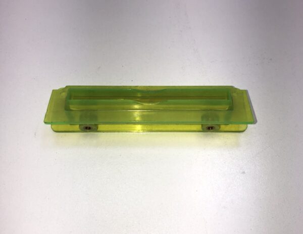 A yellow plastic Ticket Printer Bezel on a white surface. Limited availability, Legacy Part. New old Stock. GETT Part Ticket114