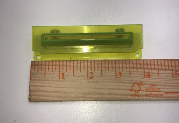 A Ticket Printer Bezel, Yellow Plastic with a Ticket Printer Bezel, Yellow Plastic and a Ticket Printer Bezel, Yellow Plastic next to it.