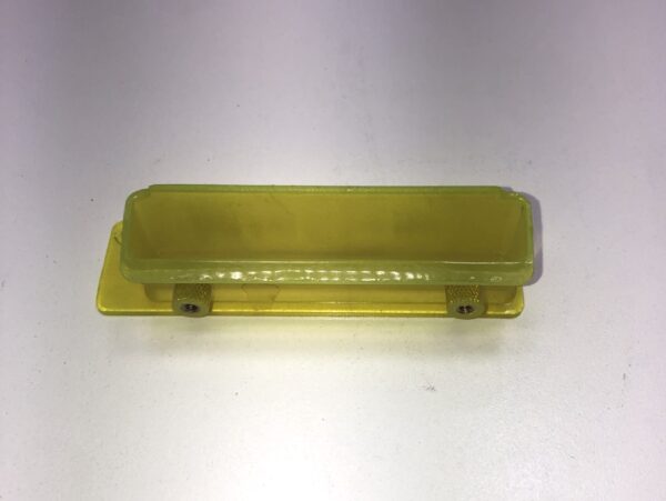 A Ticket Printer Bezel, Yellow Plastic, New. Part 4102031. Limited availability, Legacy Part. New old Stock. GETT Part Ticket115 on a white surface.