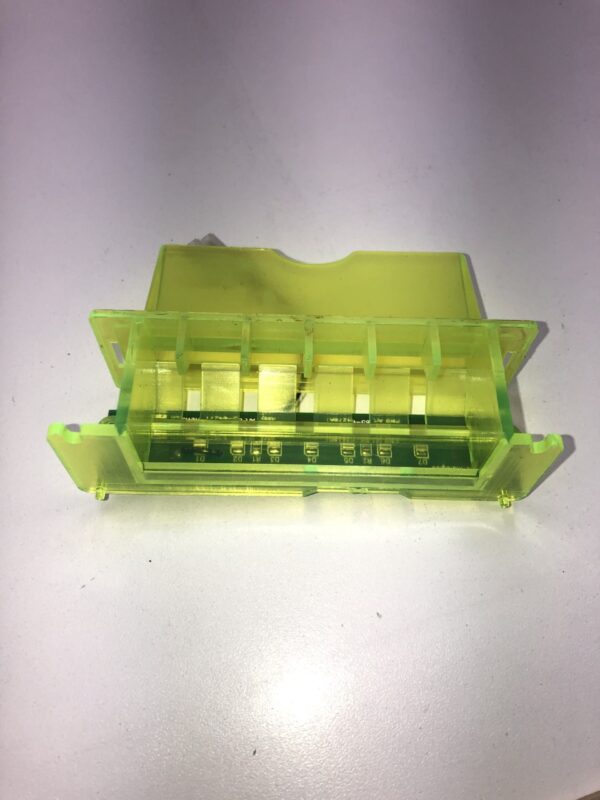 A green Ticket Printer Bezel with Light Bar. Yellow Plastic, New. Part 85-04271 Rev A plastic box with a plastic cover on it. Limited availability, Legacy Part. New old Stock. GETT Part Ticket116