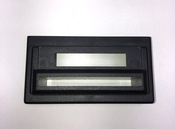 A black plastic Ticket Printer Bezel, Fits IGT Games with a screen on it.