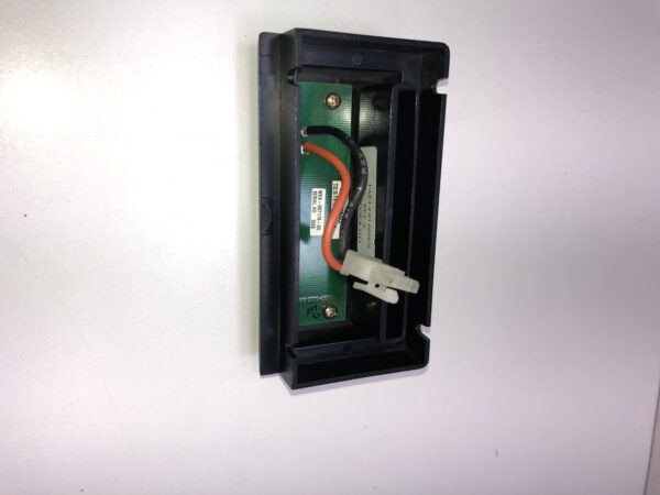 A Retrieve Ticket Bezel and assembly is attached to a wall. Includes IOB and Harness/ Connector. GETT Part Ticket123