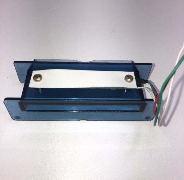 A blue plastic box with wires attached to it is the Ticket Printer Bezel with 3 pin connector. See pics. GETT Part Ticket134.