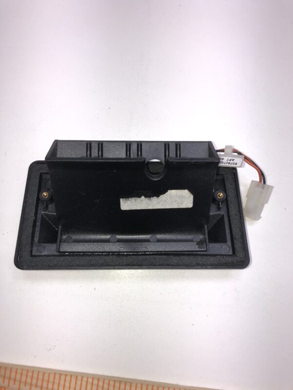 A Collect Ticket Bezel for Ticket Printer, including the bezel and connector/harness, is a new part that consists of a black piece of plastic with a wire attached to it.