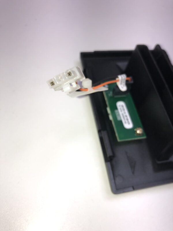 A Black Bezel with Plug for Ticket Printer. Fits IGT. See pics for Plug config and size. GETT Part Ticket138 is a small piece of plastic with a wire attached to it.