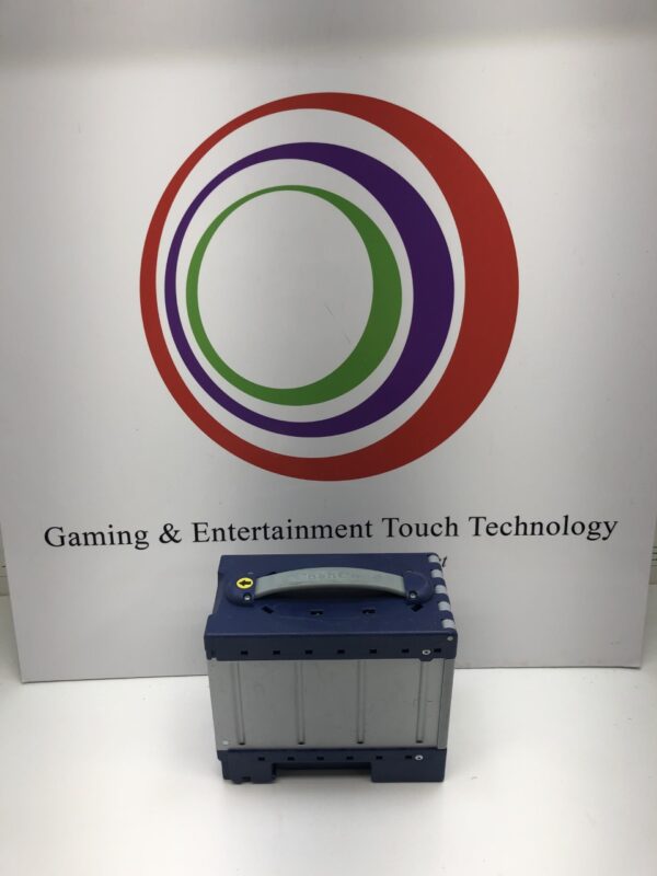 A Cash Code "ONE" Cash Can gaming and entertainment technology box in front of a sign.