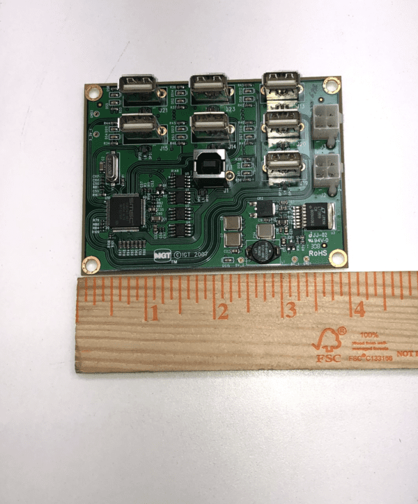 A small IGT AVP PCB Hub 7 Port USB Dongel Farm GETT Part PCBA103 with a ruler next to it.