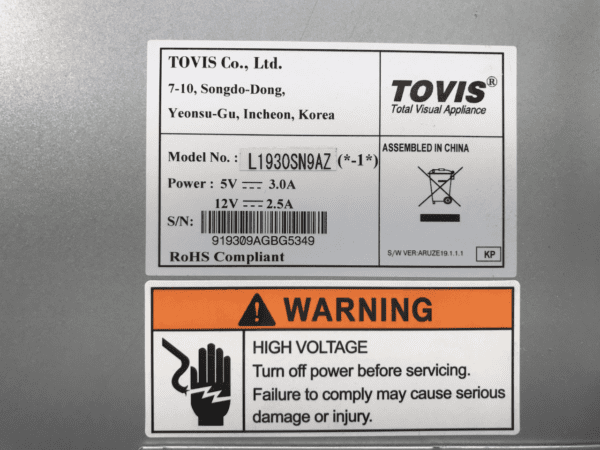 A warning label on the side of a Tovis LCD Touch Monitor for use with IGT G20 games. Wide Screen Format in 16x10. GETT Part LCDM1029.