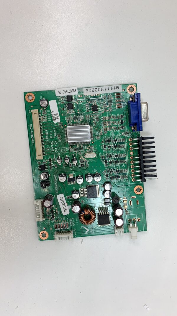 A green Wells Gardner AD-Board with many small components.