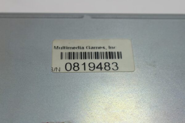 A close up of a Multi Media Games, WBV game CPU with a bar code on it.