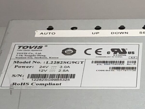 A label on the side of a 22" Tovis LCD monitor for use on IGT AVP Top Box with a label on it.