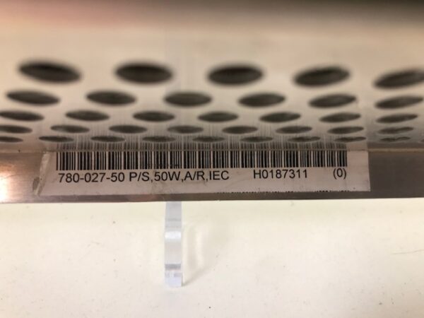 A Mikohn Gaming Stand Alone Progressive Controller bar code label on the side of a metal shelf.