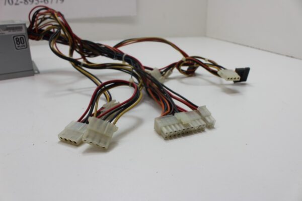 A Multi Media Games, WBV Game Power Supply with wires and cables on a table.