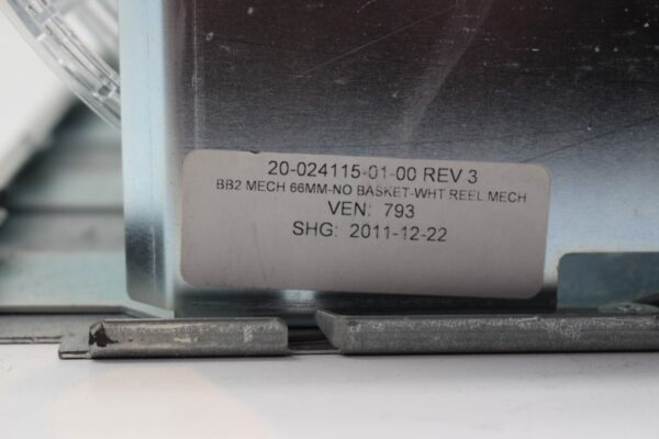A piece of Five Reel Assembly for WMS BBI/ BBII Reel Games with a label on it.