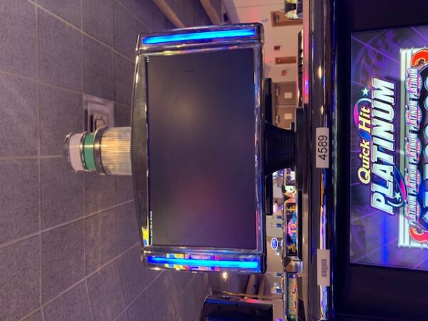 A slot machine in a casino with a Gamesman GT 3000 18" LED Topper for Bally Alpha 2. GETT Part Topper 104 on it.