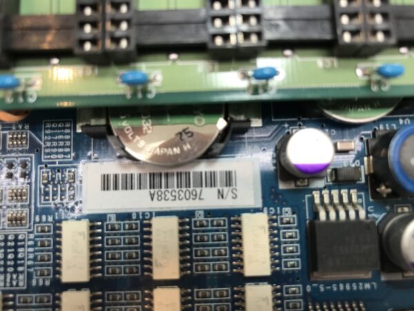 A close up of a Konami Advantage 5 CPU circuit board with electronic components.