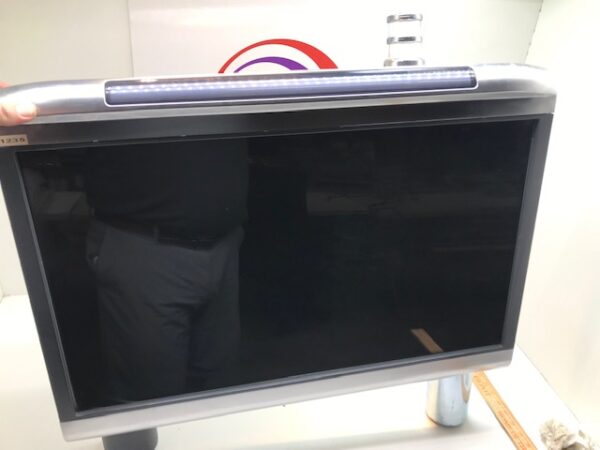 A person is standing in front of the WMS BBxD MetaScreen LCD Top Box Kit. Includes Bose Audio system. WMS Conversion Kit 1400867-AP01. GETT Part LCDM281.