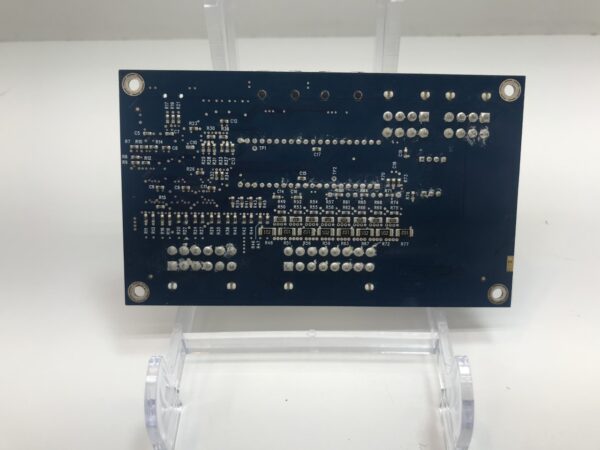 A small WMS BB1 1-Lamp Matrix Controller pcb board on top of a clear stand.