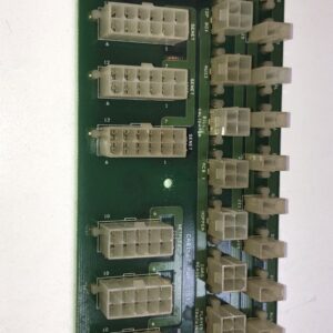 A green IGT Cabinet Power Dist. Board P/N 75803040 Rev EX with many wires on it. GETT Part PDB104.