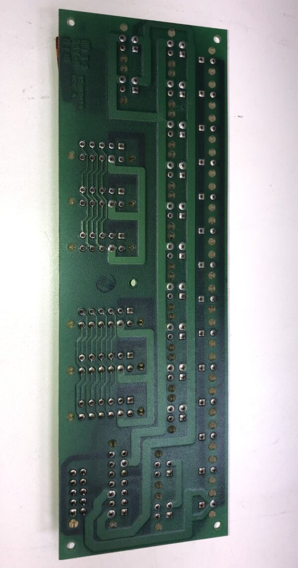 A green IGT Cabinet Power Dist. Board P/N 75803040 Rev EX. GETT Part PDB104 on a white surface.