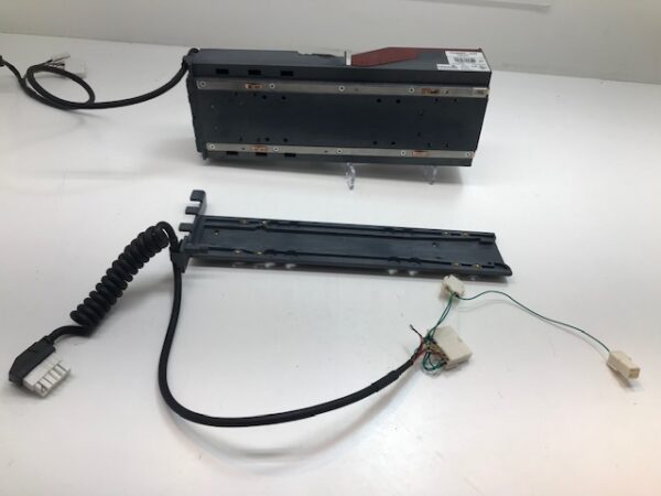 A device with the Gen 2 Printer Harness and "Home" slide in assembly unit attached to it.