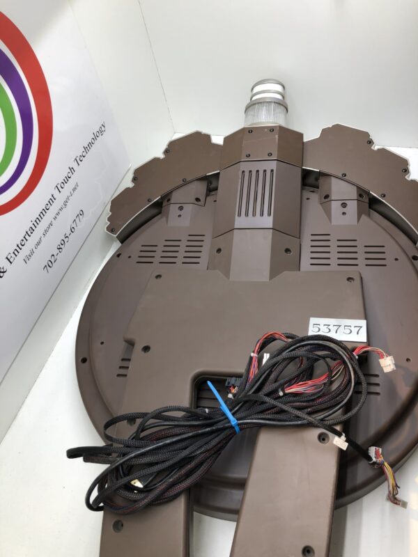 A Bally Wave Topper WHEEL with Large LCD. Includes Mount hardware. Like New. GETT Part Topper 108, a brown circular device with wires attached to it.