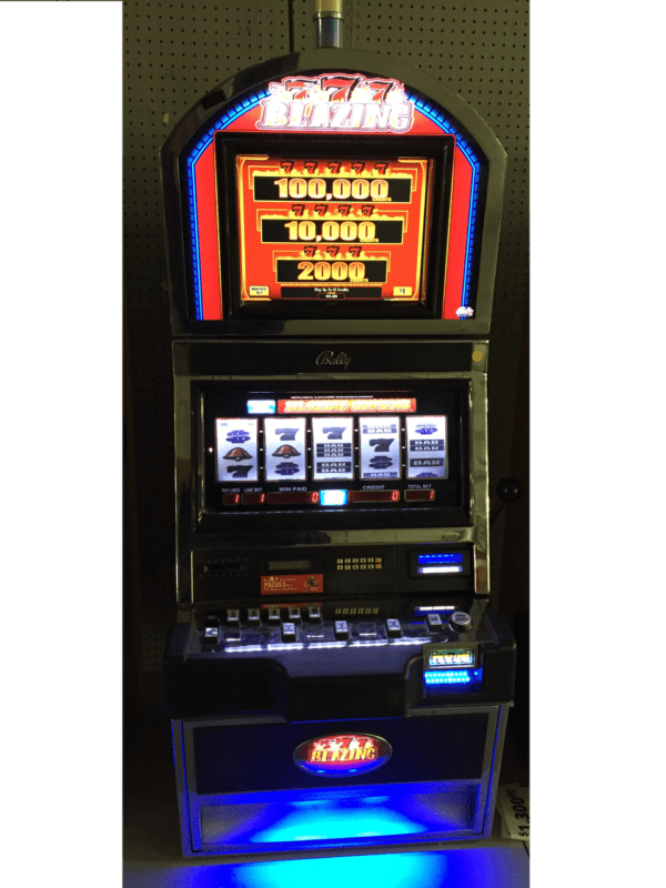 A slot machine with a blue light on it.