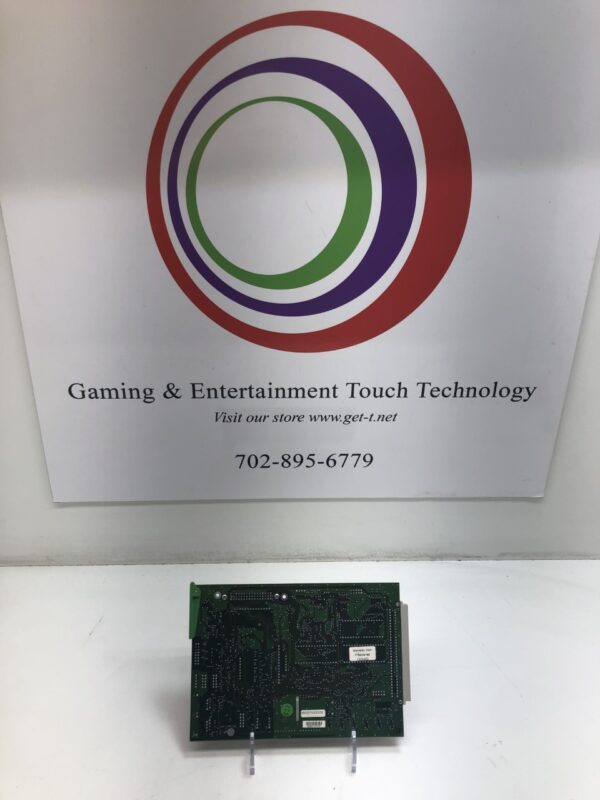 A gaming and entertainment Atronic E-Motion Comm' Board in front of a sign.