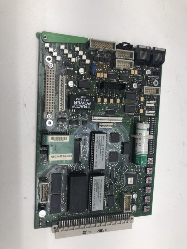 An Atronic E-Motion Comm' Board with a number of components on it.