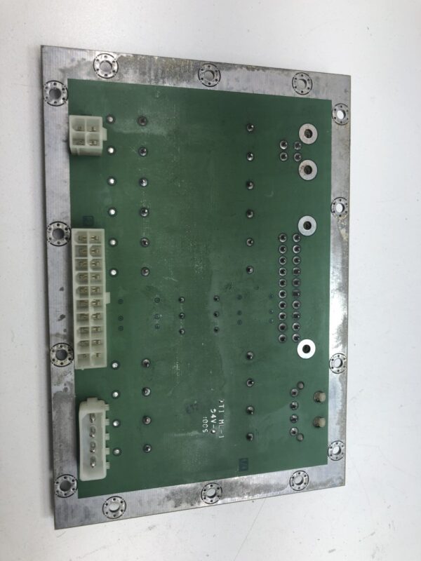 A green Atronic E-Motion Filter Board with a number of wires on it.