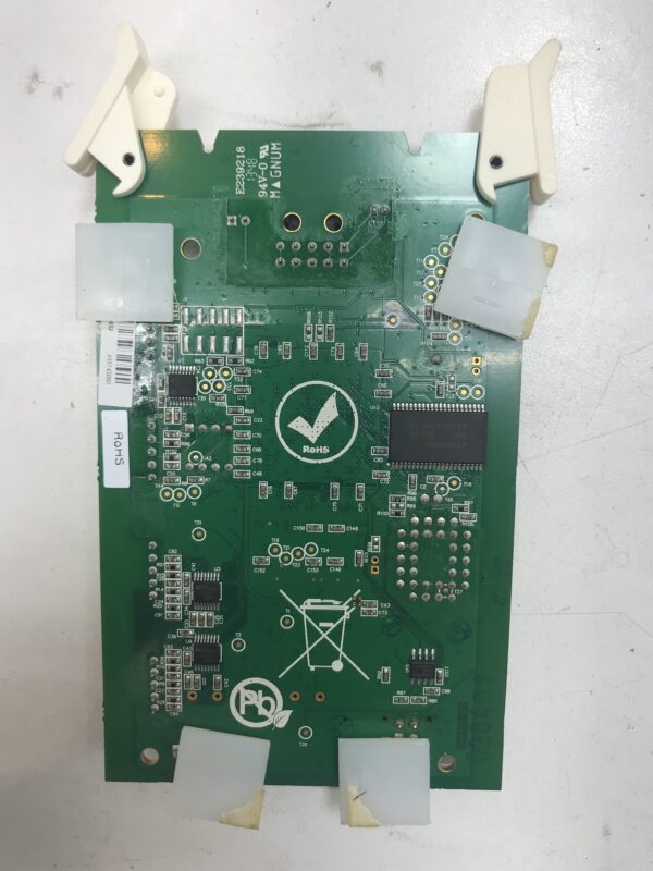 A green SPC-2.5 for Aristocrat games PCB board with a chip on it.