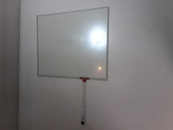 A 17.54" Ino Touch Sensor hanging on the wall of a room.